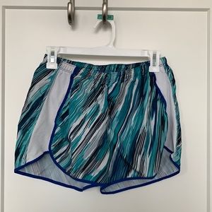 Blue athletic shorts. Size S but fits a M.